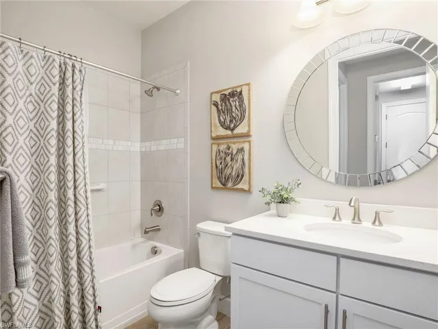 a view of a dining room with furniture and window