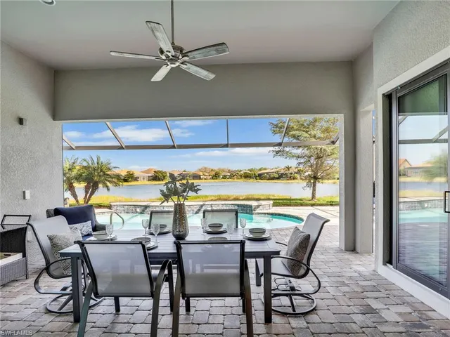 a view of a swimming pool with a lounge chair