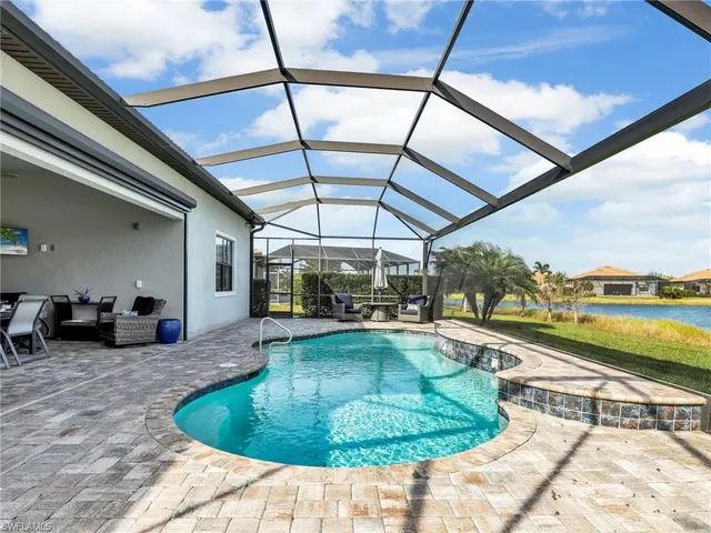an empty room with furniture and a gym machine