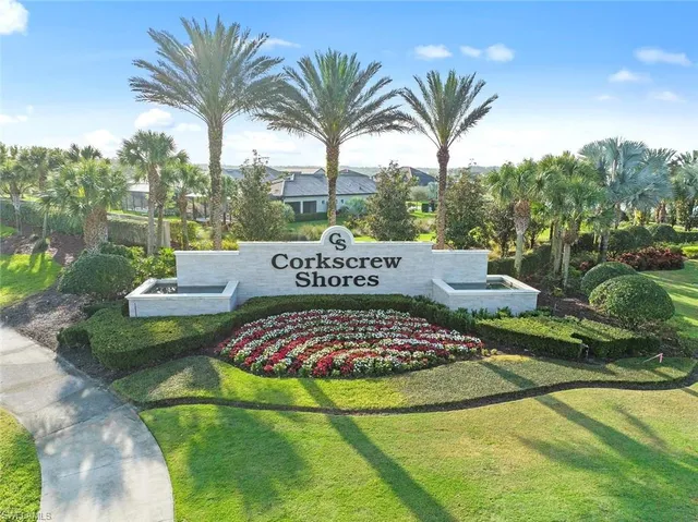an aerial view of a house with lake view