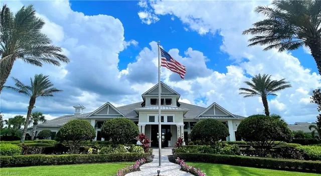 a living room with lots of furniture and a large window
