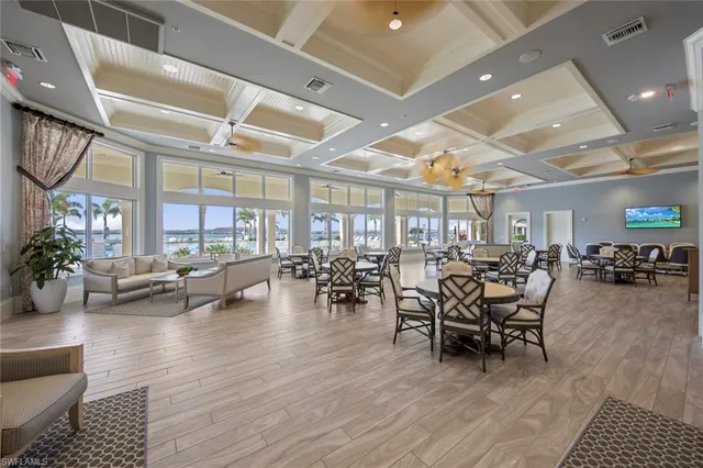 a view of a dining room with furniture window and plants