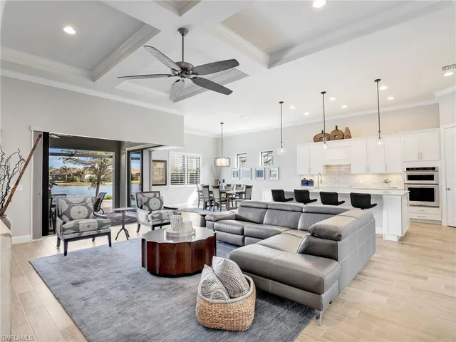 a view of a room with furniture and windows