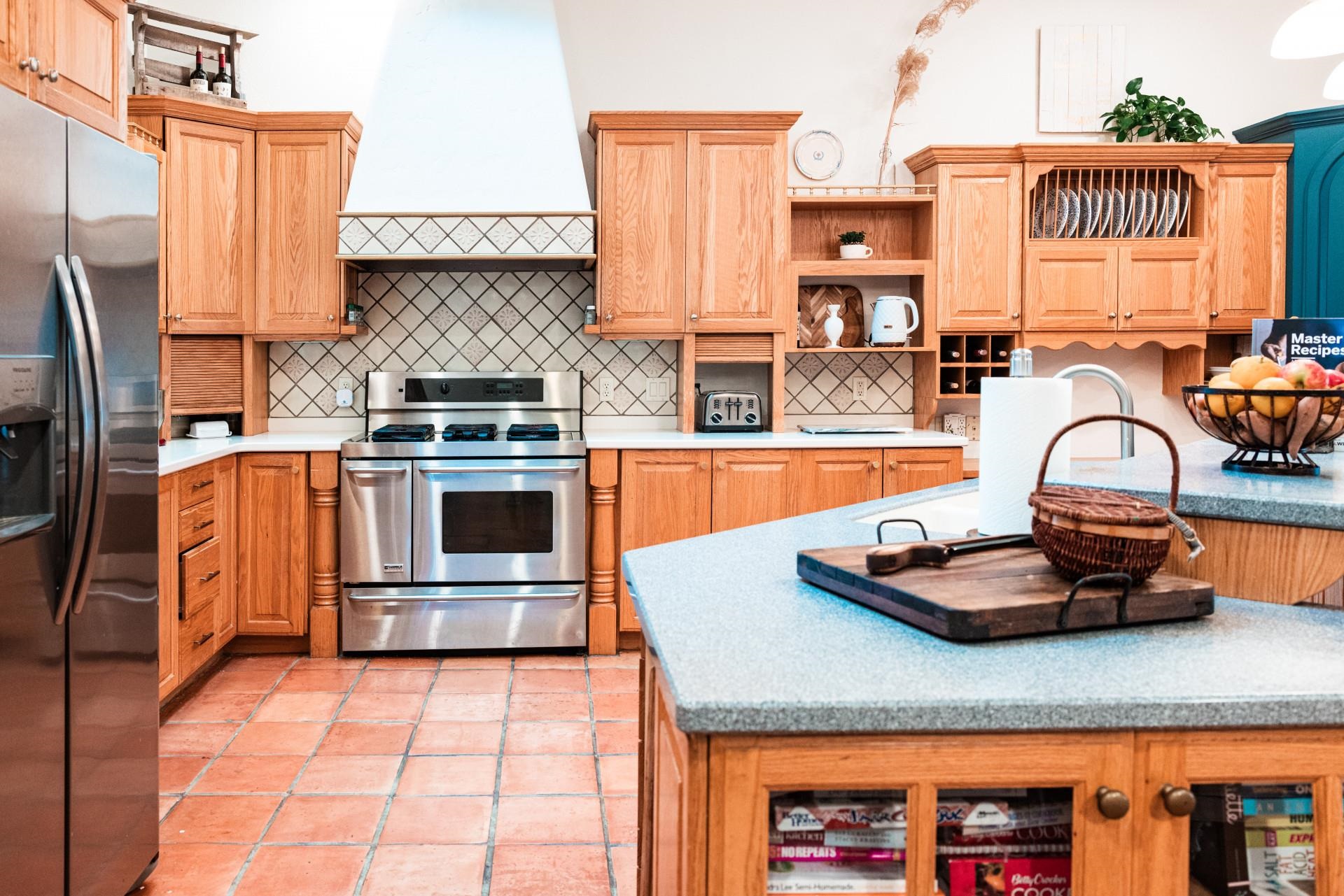 2619 H Road Grand Junction, CO 81506 - Photo 15 of 39 a kitchen with stainless steel appliances granite countertop a sink stove and refrigerator
