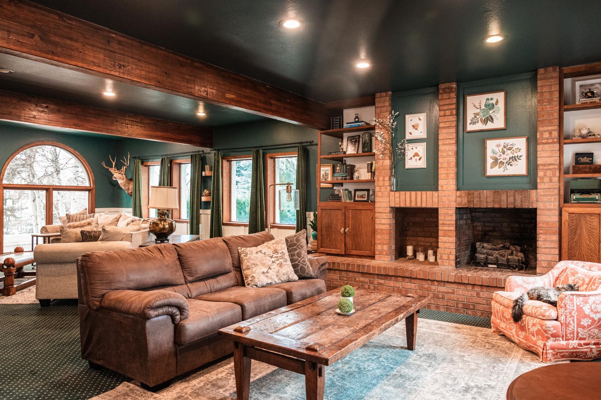 2619 H Road Grand Junction, CO 81506 - Photo 21 of 39 a living room with fireplace furniture and a large window