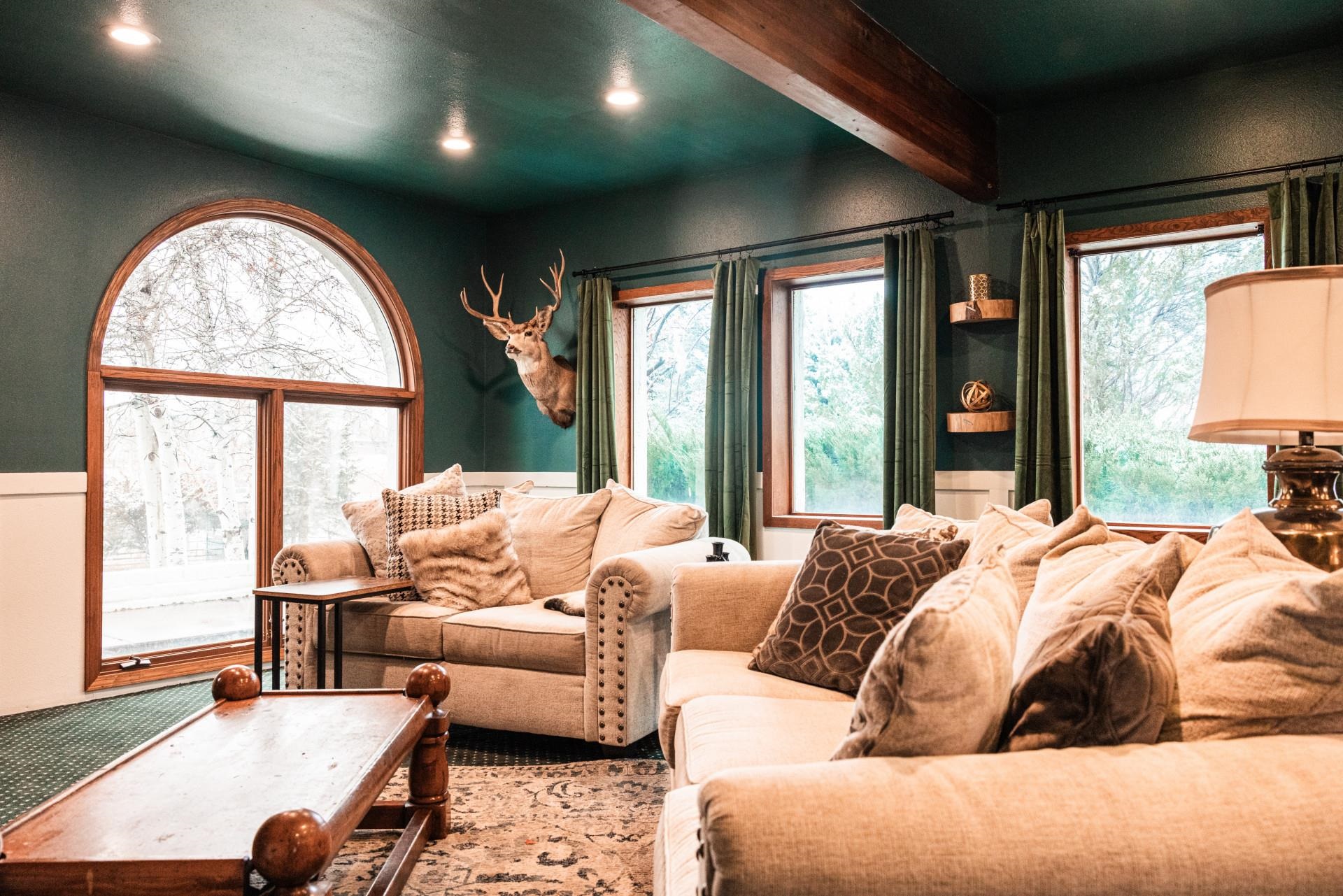 2619 H Road Grand Junction, CO 81506 - Photo 23 of 39 a living room with a large bed and a large window