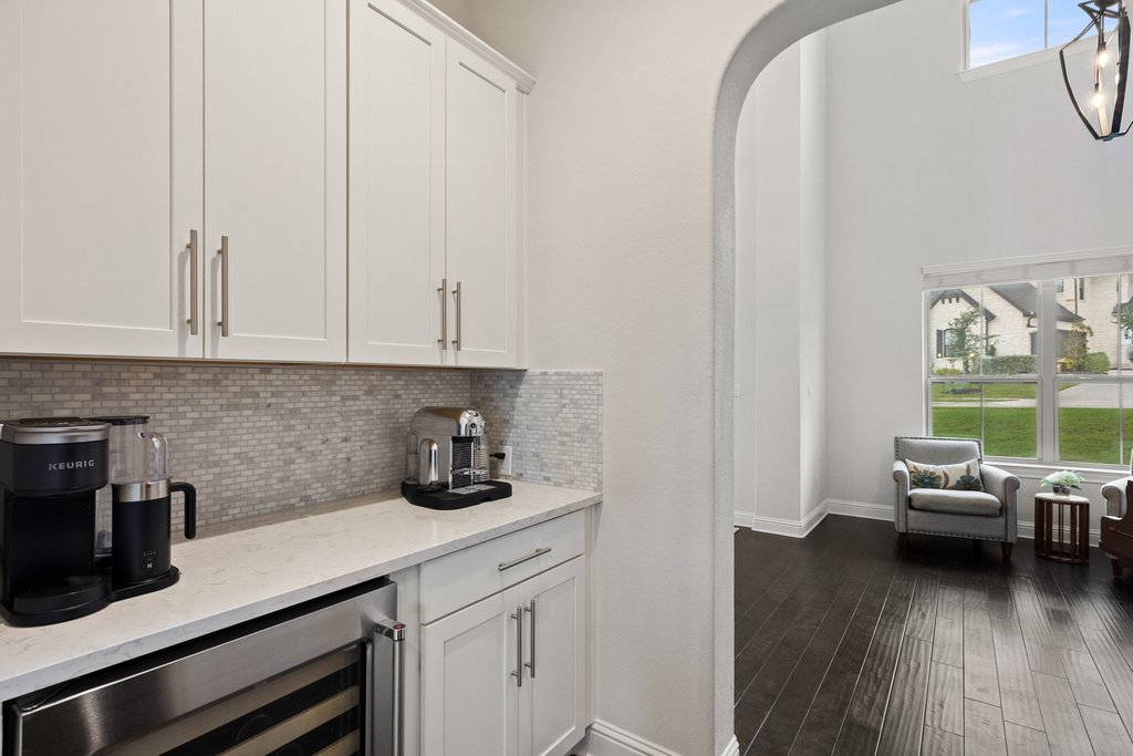 215 Lodestone Lane Austin, TX 78738 - Photo 18 of 40 A convenient dry bar with a sleek wine fridge stands ready for entertaining.