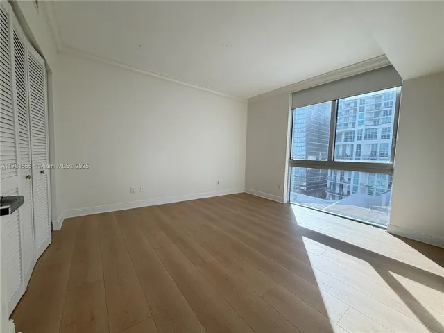 a spacious bathroom with a granite countertop sink a toilet and shower