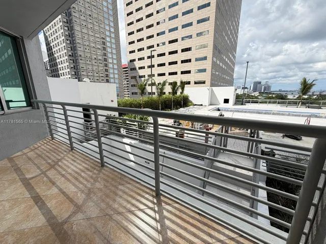 a kitchen with stainless steel appliances granite countertop a stove microwave and sink