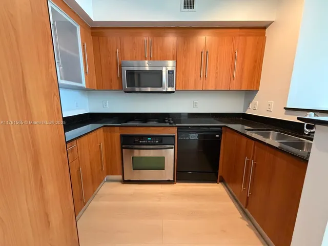 a view of hallway with cabinets