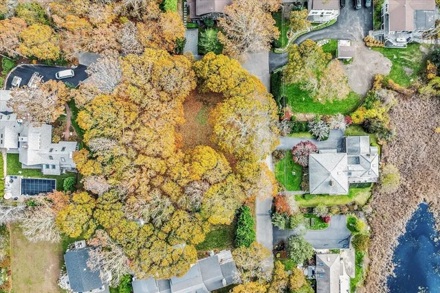 a aerial view of residential houses with outdoor space