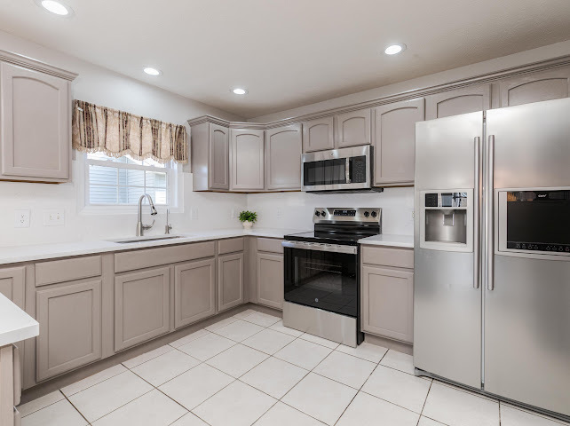 2275 Boulder Drive Normal, IL 61761 - Photo 11 of 41 a kitchen with granite countertop cabinets and steel stainless steel appliances