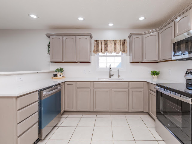 2275 Boulder Drive Normal, IL 61761 - Photo 13 of 41 a kitchen with a sink cabinets and stainless steel appliances