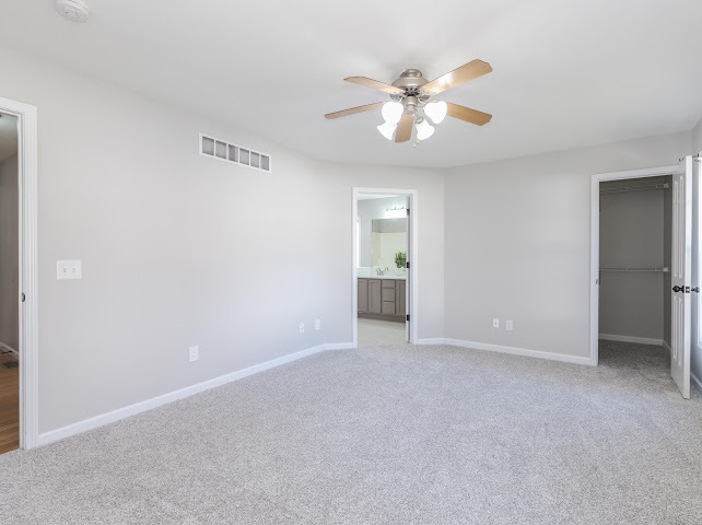 2275 Boulder Drive Normal, IL 61761 - Photo 21 of 41 a view of an empty room with a chandelier fan