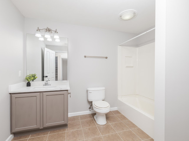 2275 Boulder Drive Normal, IL 61761 - Photo 28 of 41 a bathroom with a toilet a sink and a mirror