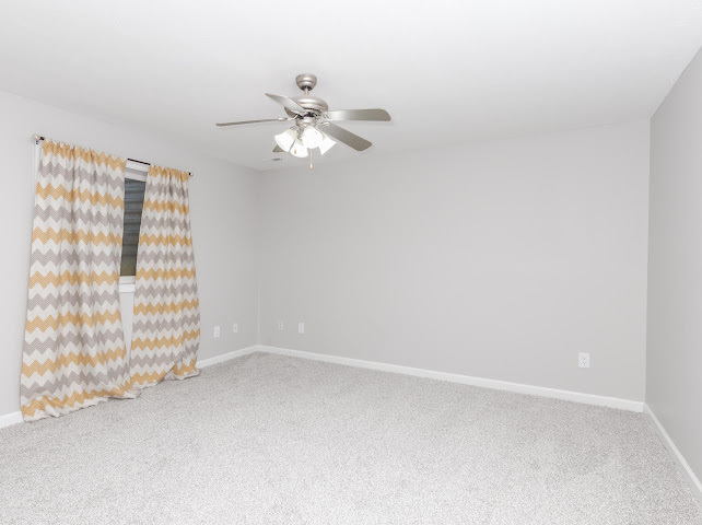2275 Boulder Drive Normal, IL 61761 - Photo 29 of 41 an empty room with windows and fan