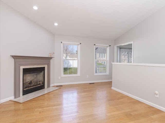2275 Boulder Drive Normal, IL 61761 - Photo 6 of 41 a view of an empty room with a fireplace and a window