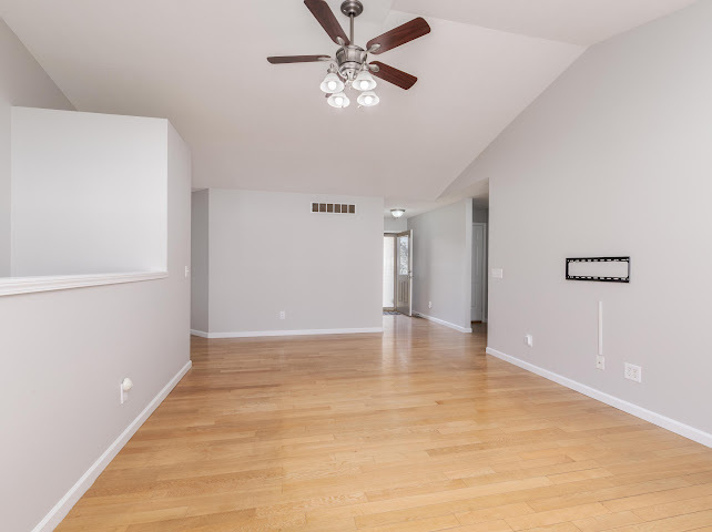2275 Boulder Drive Normal, IL 61761 - Photo 7 of 41 a view of an empty room with window and a ceiling fan