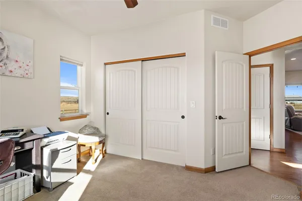 a view of a bedroom with natural light