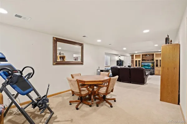a living room with furniture a table and chairs