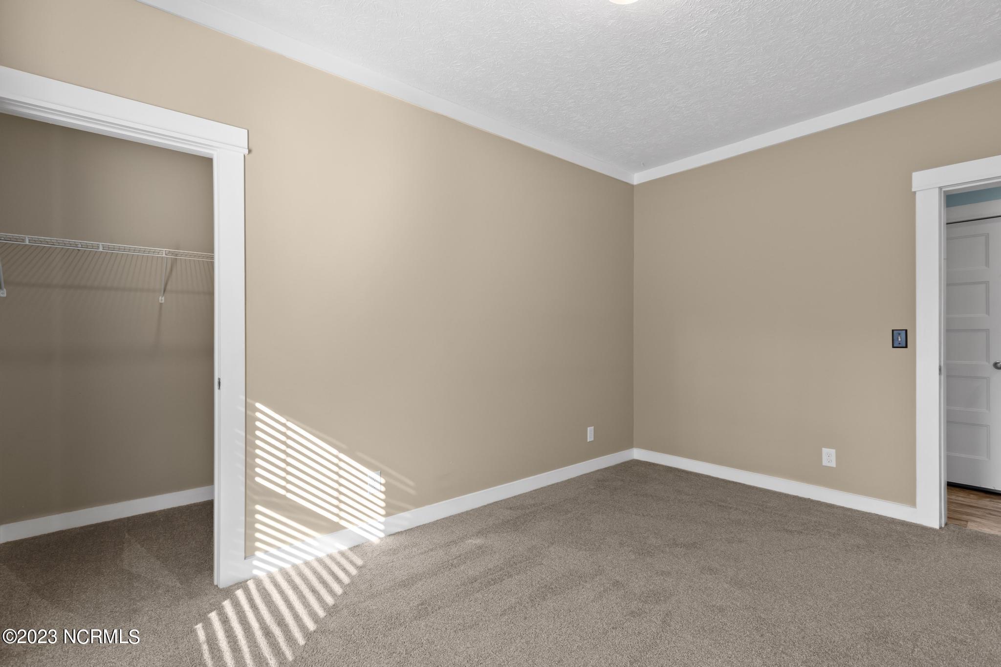 107 A Colbert Lane Hampstead, NC 28443 - Photo 9 of 32 Front Bedroom and Walk-in Closet
