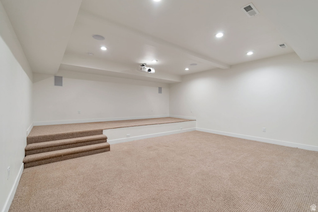 1820 West Farmhouse Flats Road Peoa, UT 84061 - Photo 41 of 79 Spacious multi-level room featuring plush carpeting, a built-in projector, recessed ceiling lighting, and integrated ceiling speakers