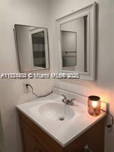 Kendale Lakes Miami, FL 33183 - Photo 16 of 18 a bathroom with double sink and two mirror