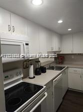 Kendale Lakes Miami, FL 33183 - Photo 8 of 18 a kitchen with a sink and stove