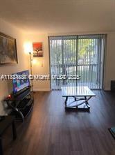 Kendale Lakes Miami, FL 33183 - Photo 9 of 18 a living room with furniture and a flat screen tv