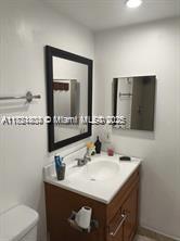 Kendale Lakes Miami, FL 33183 - Photo 10 of 18 a bathroom with a sink vanity and a toilet