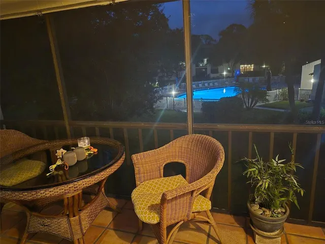 an aerial view of a house with swimming pool garden and patio