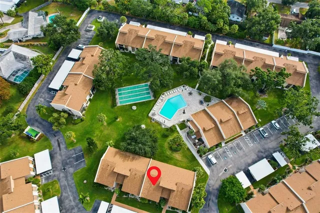 an aerial view of residential houses with outdoor space