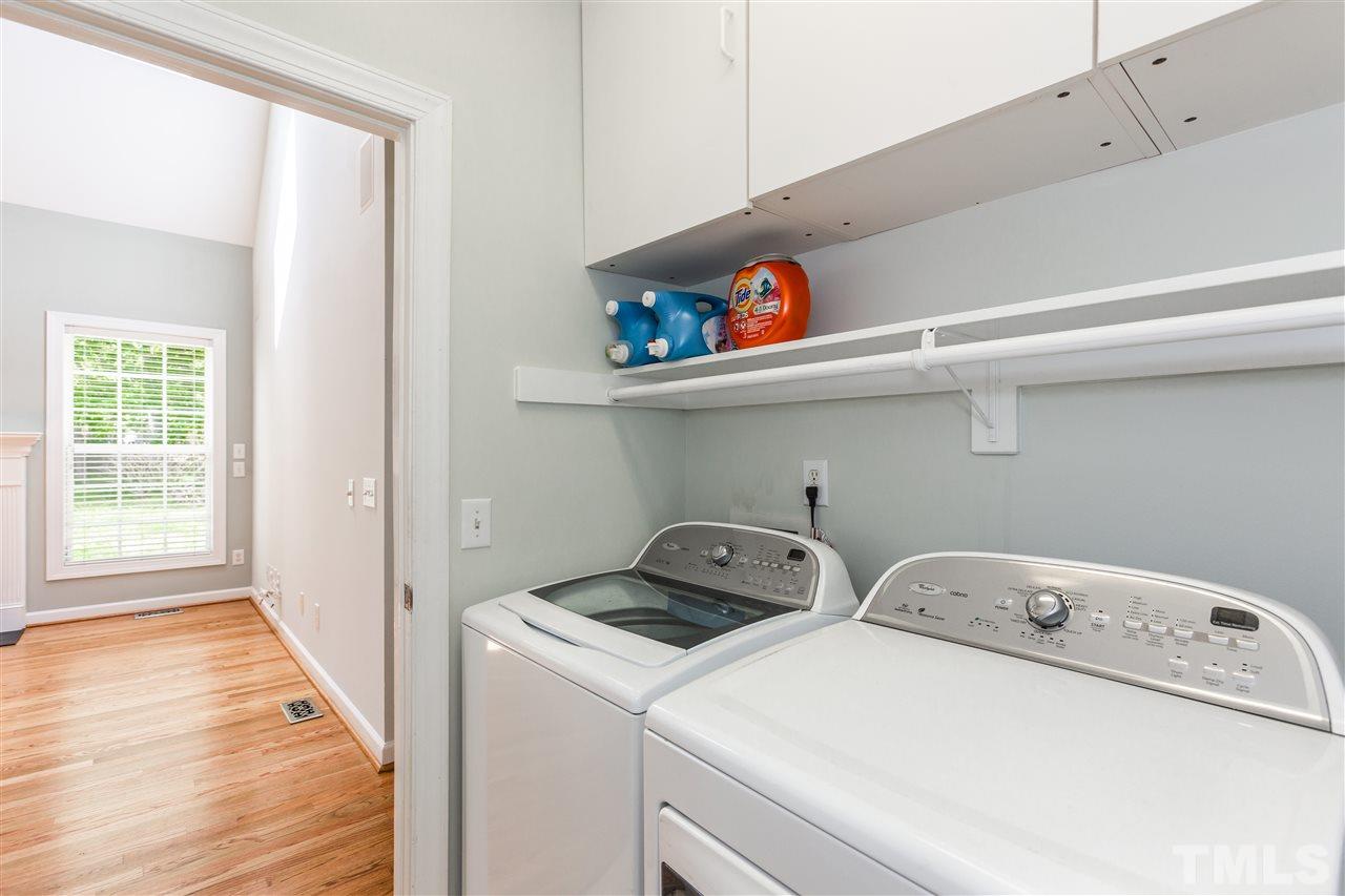 905 Cedar Downs Drive Raleigh, NC 27607 - Photo 14 of 25 a utility room with dryer and washer
