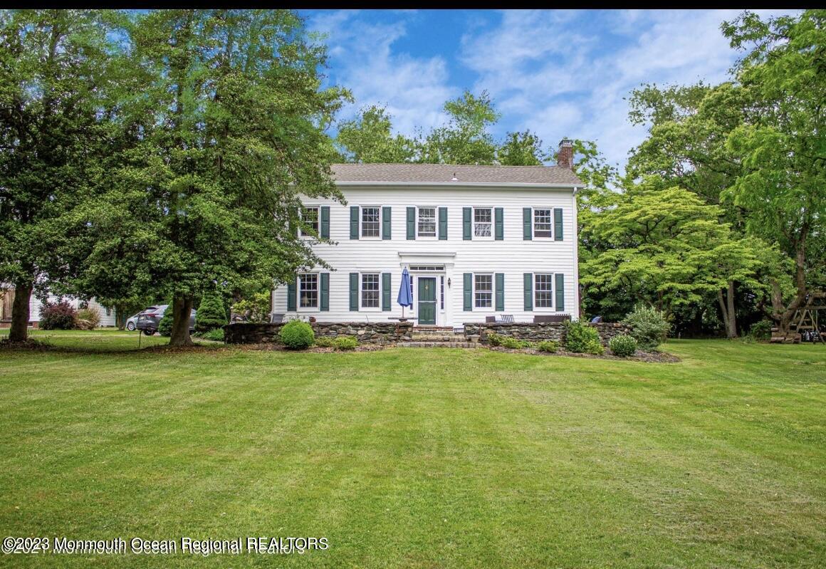 415 Pleasant Valley Road Morganville, NJ 07751 - Photo 1 of 16 a view of a house with a big yard
