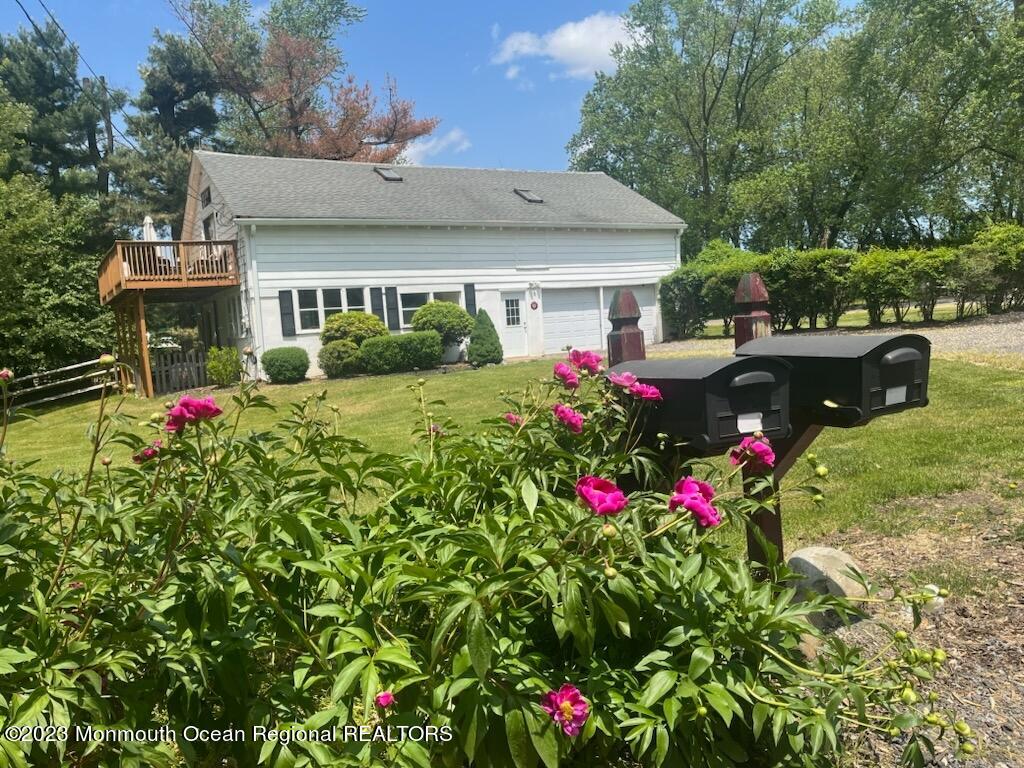 415 Pleasant Valley Road Morganville, NJ 07751 - Photo 4 of 16 a view of a house with a big yard and potted plants