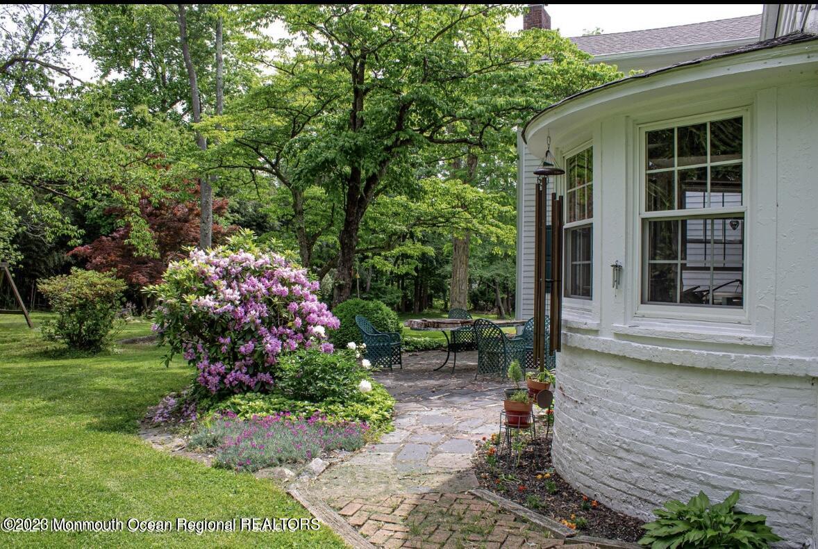 415 Pleasant Valley Road Morganville, NJ 07751 - Photo 7 of 16 a front view of a house with a yard
