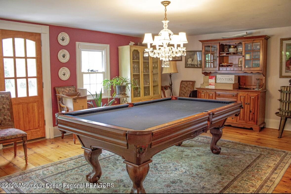 415 Pleasant Valley Road Morganville, NJ 07751 - Photo 9 of 16 a room with pool table and windows