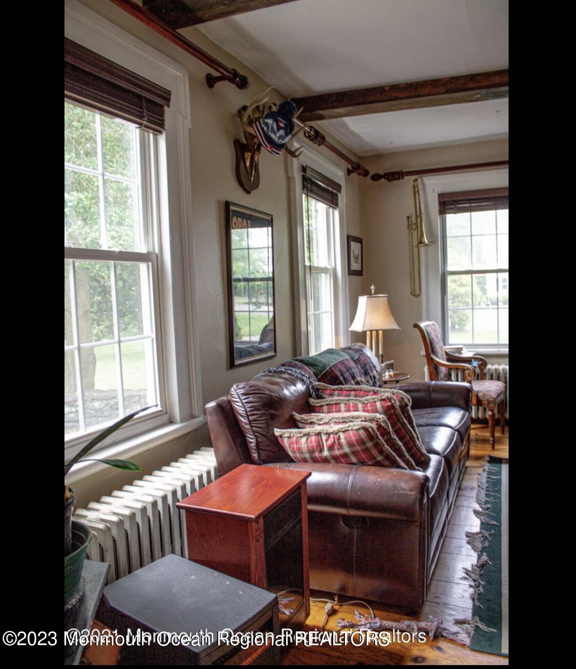 415 Pleasant Valley Road Morganville, NJ 07751 - Photo 10 of 16 a living room with furniture and a large window