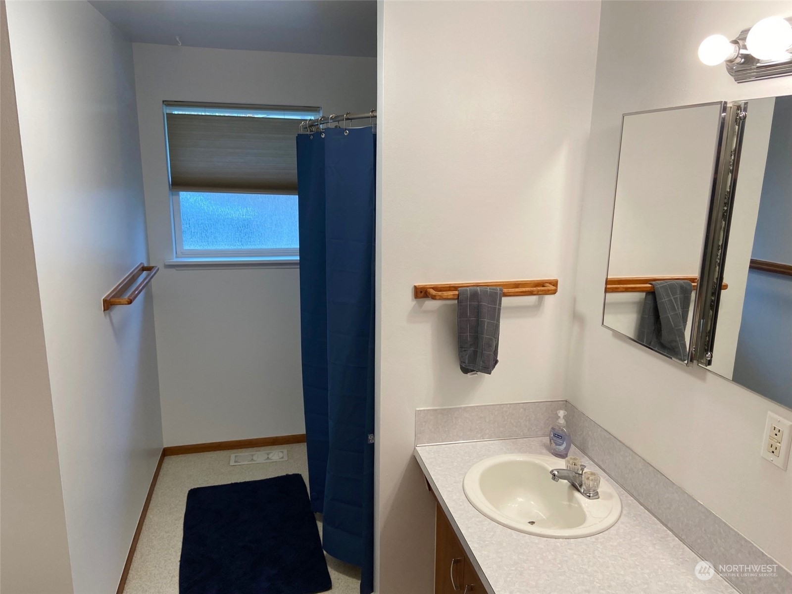 12733 2nd Avenue Southwest Burien, WA 98146 - Photo 12 of 27 a bathroom with a sink a mirror and vanity