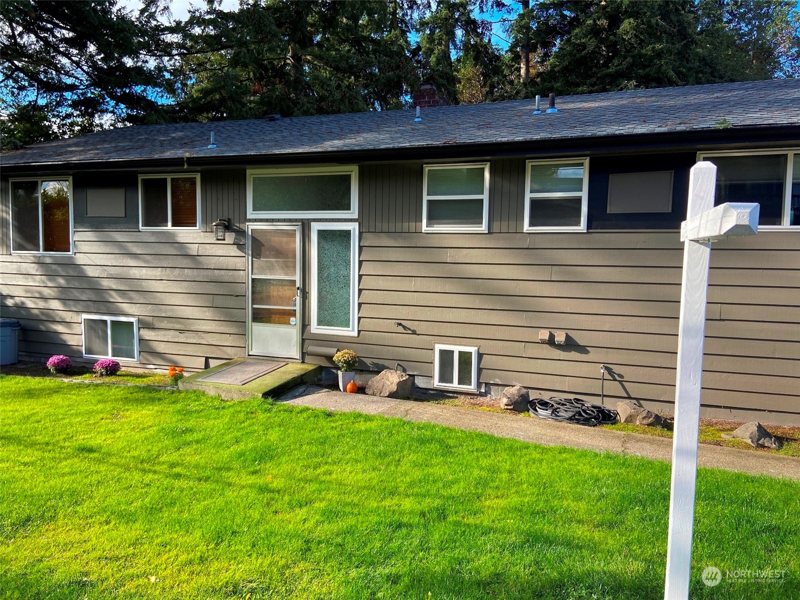 12733 2nd Avenue Southwest Burien, WA 98146 - Photo 21 of 27 a front view of a house with a yard