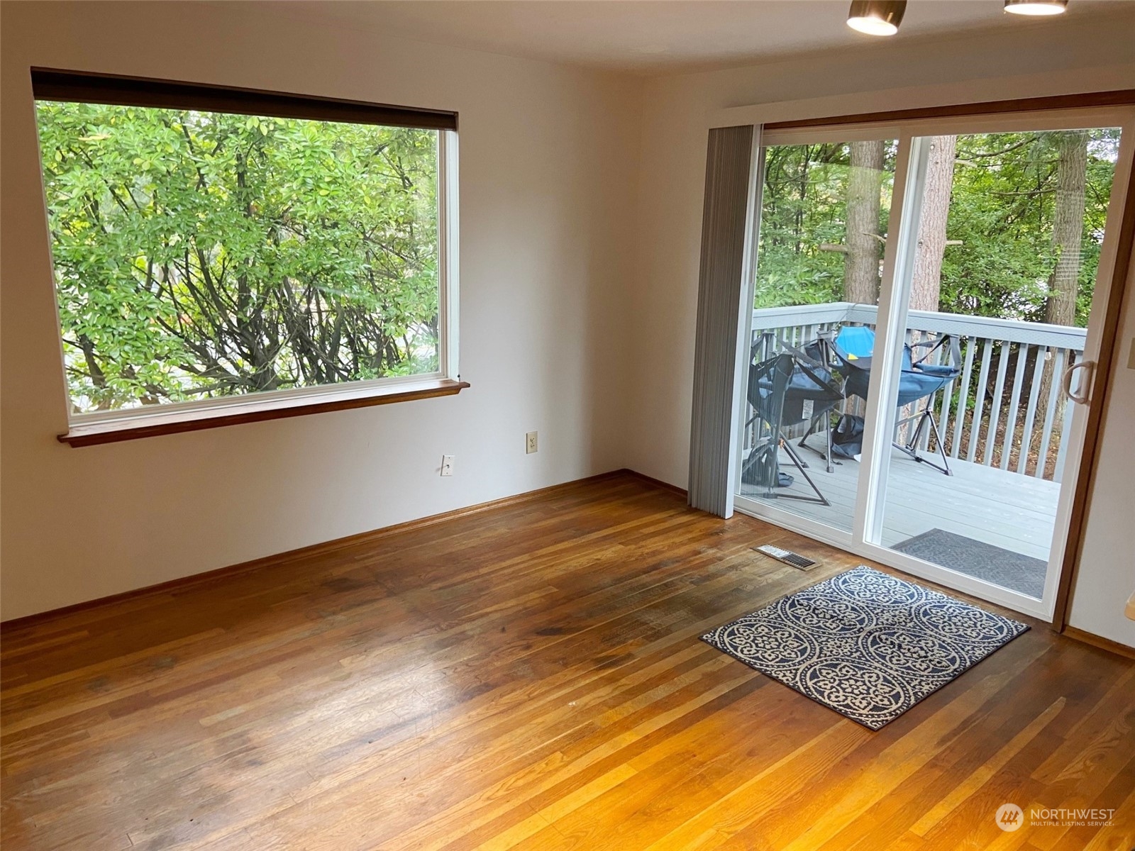 12733 2nd Avenue Southwest Burien, WA 98146 - Photo 8 of 27 a view of an empty room with wooden floor and a window