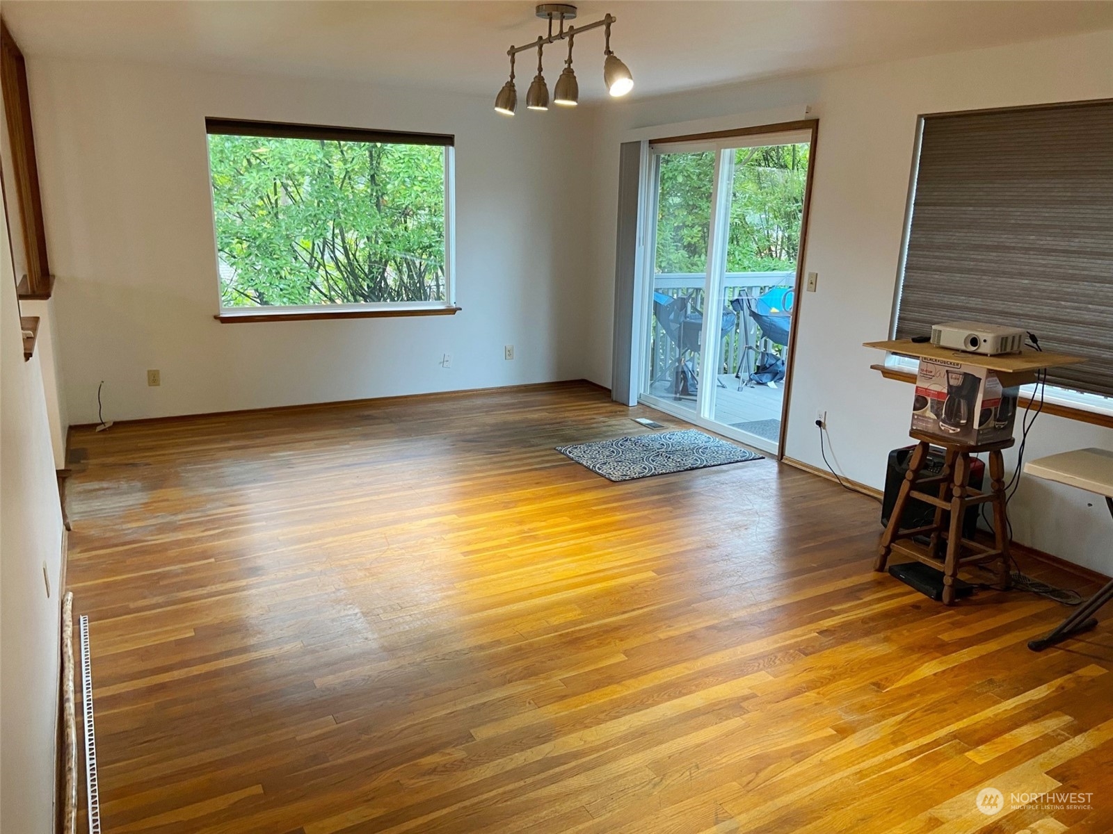 12733 2nd Avenue Southwest Burien, WA 98146 - Photo 9 of 27 a view of a room with wooden floor and windows