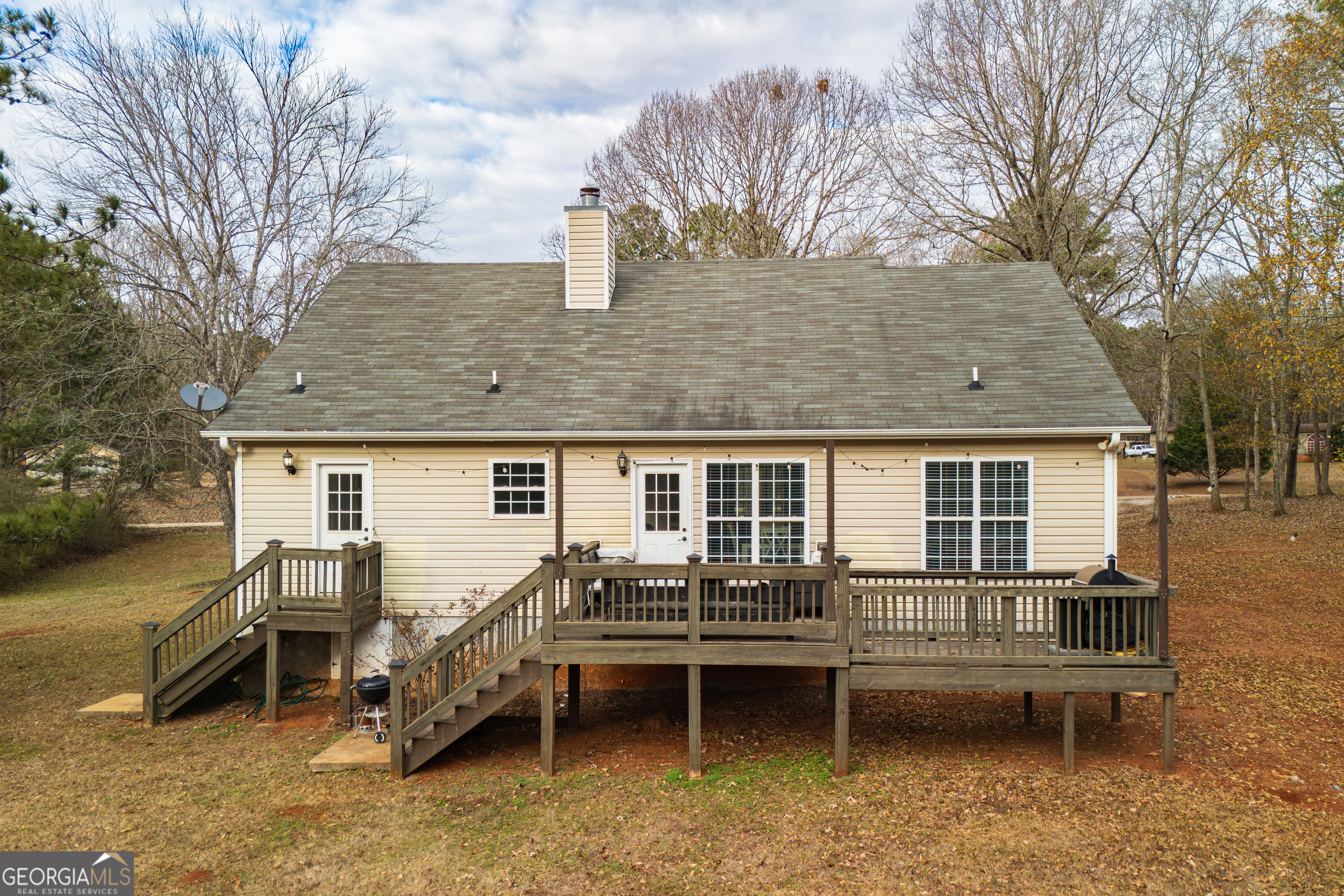 171 Hunter Road Griffin, GA 30224 - Photo 14 of 31 a backyard of a house with outdoor seating