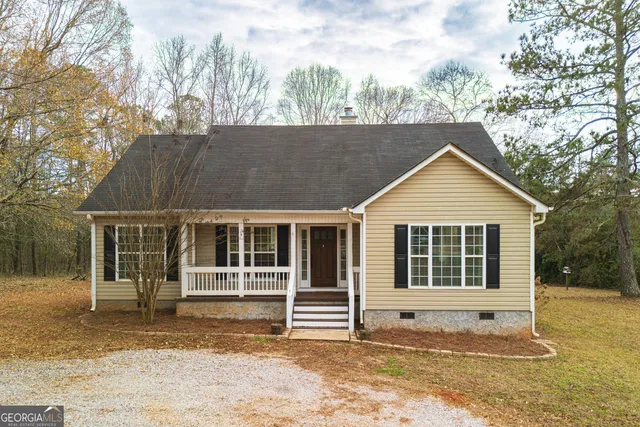 a house with trees in the background