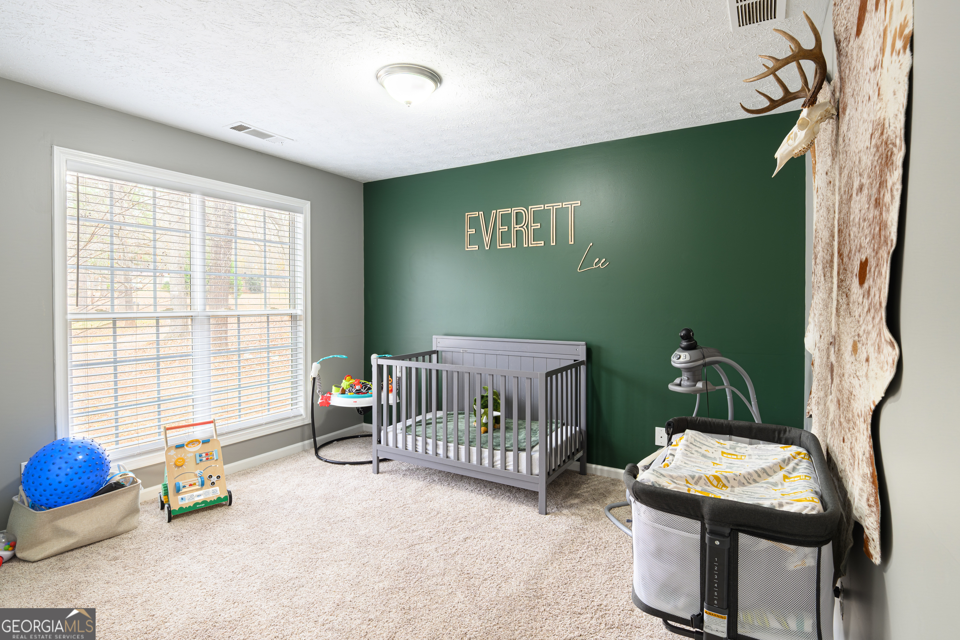 171 Hunter Road Griffin, GA 30224 - Photo 25 of 31 a bedroom with furniture and a window