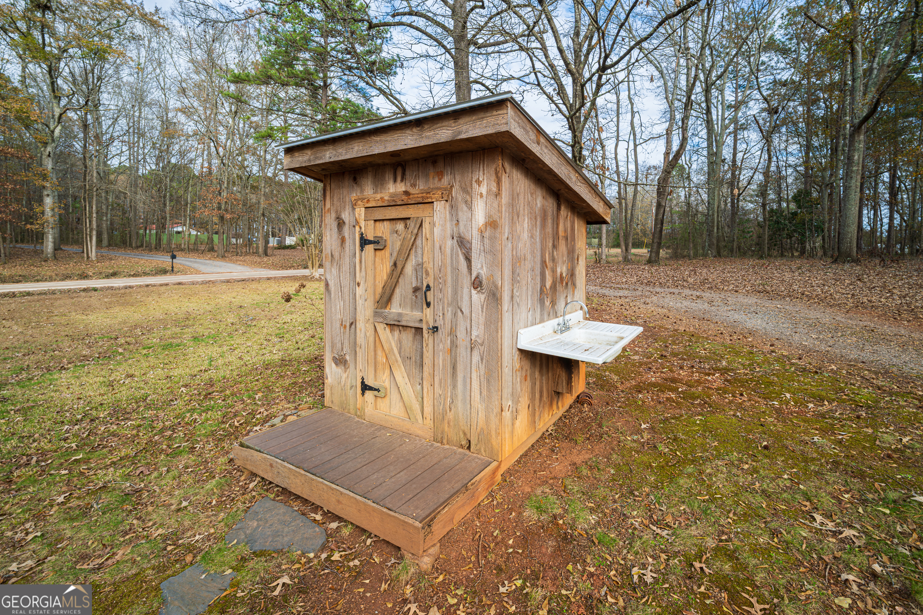 171 Hunter Road Griffin, GA 30224 - Photo 3 of 31 a view of a house with backyard and trees