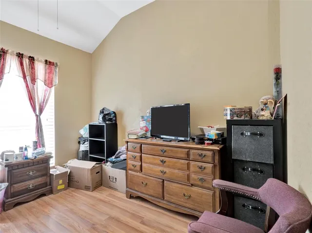 a room with furniture and a flat screen tv