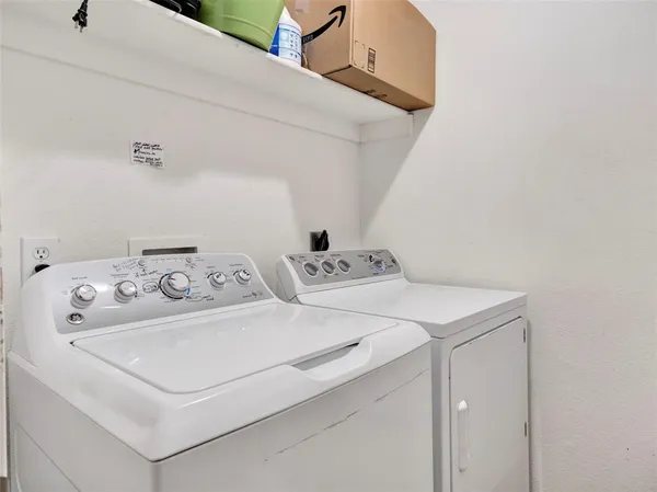 a kitchen with stainless steel appliances granite countertop a sink a stove and a microwave