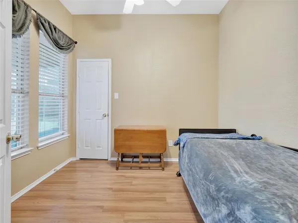 a view of bedroom with furniture and wooden floor