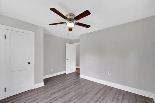 61 East Longmeadow Road Hampden, MA 01036 - Photo 27 of 38 an empty room with wooden floor and a ceiling fan